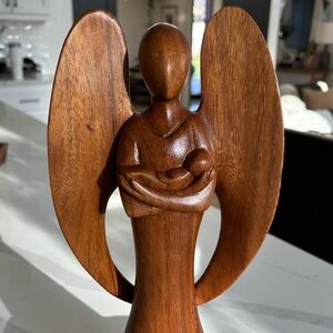 Hand carved Angel holding baby